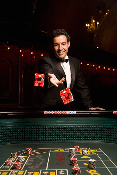 Live dealer rolling three dice in Super Sic Bo game